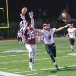 PHOTO BY SHAWN DONNELLY Montesano receiver Caydan Lovell (35) makes a catch against Napavines Ethan Lantz during Montesanos 56-47 loss on Friday in Montesano.