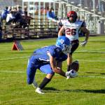 RYAN SPARKS | THE DAILY WORLD Elma receiver René Duran (18) catches a 26-yard pass for a touchdown against Mt. Baker defender Kevin Tucker during a 28-13 loss to the Mountaineers on Saturday at Davis Field in Elma.