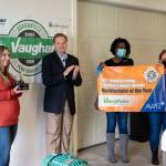 Stacie Vaughan, CFO of Vaughan Industries, accepts the 2021 AWB Manufacturer of the Year award from AWB President Kris Johnson on Oct. 1, 2021, during a visit by the AWB Manufacturing Week bus tour to Vaughans Montesano facility. (Photo: Brian Mittge/AWB).