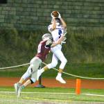 RYAN SPARKS | THE DAILY WORLD Eatonville wide receiver Jakob Lucht (9) catches a touchdown pass while being defended Montesano defender Kaleb Ames during the Bulldogs 35-18 loss to the Cruisers on Friday in Montesano.