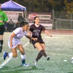 RYAN SPARKS | THE DAILY WORLD Montesano midfielder Jaiden King (23) passes the ball away from Elma midfielder Eliza Sibbett during Montes 1-0 win on Thursday in Montesano.