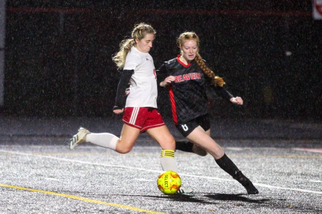 PHOTO BY BEN WINKELMAN Hoquiam midfielder Emma Johnson shoots while being defended by Teninos Andee Schaffran during the Grizzlies 2-1 loss on Tuesday in Tenino.