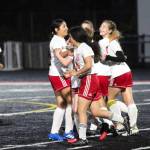 PHOTO BY BEN WINKELMAN Hoquiam midfielder Emma Johnson, right, is congratulated by her teammates after scoring a goal in the 70th minute in the Grizzlies 2-1 loss to Tenino on Tuesday at Tenino High School.