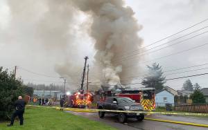 Courtesy of Grays Harbor Fire District 2
Smoke rises into the sky from a structure fire on Grant Street in Aberdeen on Wednesday, Oct. 27, 2021.