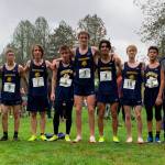 SUBMITTED PHOTO The Aberdeen boys cross country team of (from left) assistant coach Ivy Lyles, Joel Nelson (9), Nolan Juransin (7), Henry Nelson (8), Will Boling (3), Julian Campos (4), Gary Sherman (10), Jacob Hallak (5) and head coach Steve Reed competed at the 2A/1A District 4 Championship meet on Thursday at the Lewis River Golf Course in Woodland. Boling, Campos and Sherman advanced to the state title meet in Pasco on Nov. 6.