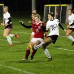 PHOTO BY BEN WINKELMAN Montesano forward Anabelle Estrada (27) sends the ball forward while being defended by Hoquiam midfielder Emma Johnson during the Bulldogs 8-0 win on Thursday in Hoquiam.