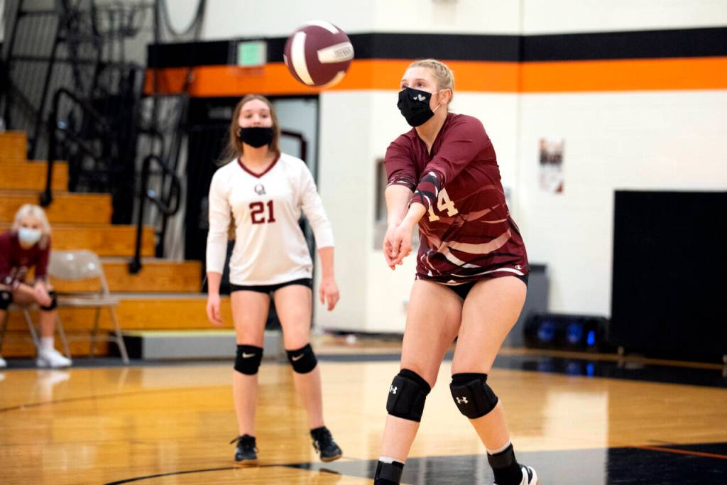 ERIC TRENT | THE CHRONICLE Ocostas Emily Scott (14) gets in front of a ball hit by Rainier in the a 2B District 4 playoff match Wednesday at Napavine High School.