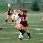 RYAN SPARKS | THE DAILY WORLD Montesanos Jaiden Morrison looks upfield while being defended by Lakeside-Nine Mile Falls Ayanna Tobeck during the Bulldogs 3-1 victory in the 1A State Girls Soccer Tournament on Wednesday in Montesano. Morrison figured into all three Monte goals, scoring twice and assisting on two others.