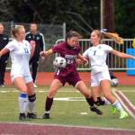RYAN SPARKS | THE DAILY WORLD Montesano midfielder Bethanie Henderson (22) is sandwiched between Lakeside-Nine Mile Falls Hayden Rickey (13) and Ayanna Tobeck during the first half of Montesano 3-1 win in a 1A State Girls Soccer Tournament game on Wednesday in Montesano.