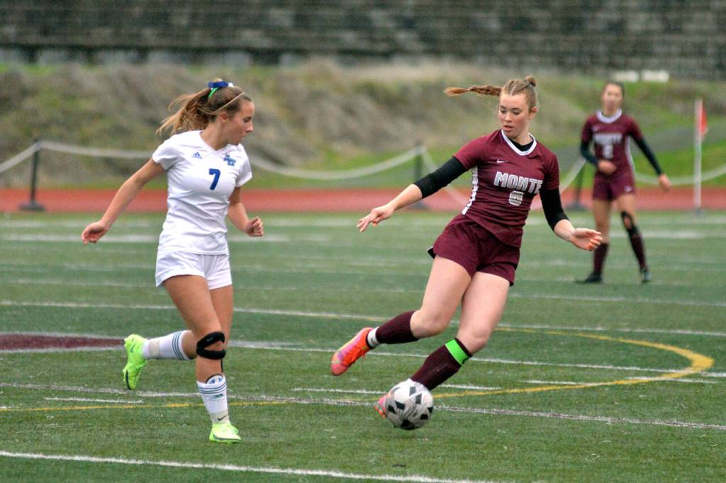 RYAN SPARKS | THE DAILY WORLD Montesano midfielder Paige Lisherness (8) defends against Lakeside-Nine Mile Falls midfielder Ayanna Tobek during Montes 3-1 state-playoff victory on Wednesday in Montesano.