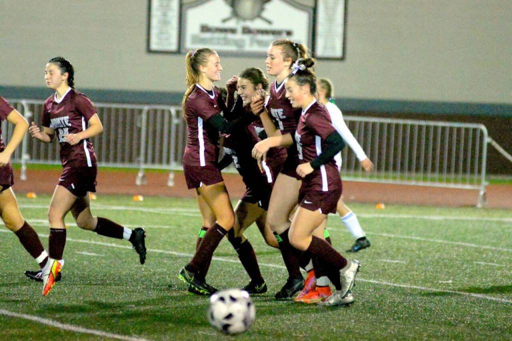 RYAN SPARKS | THE DAILY WORLD Montesanos Madi Campbell, left, Paige Lisherness, second from right, and Jaiden King, right, celebrate with teammate Jaiden Morrison after the senior forward scored a game-clinching goal in a 3-1 victory over Lakeside-Nine Mile Falls in a 1A State Girls Soccer Tournament first-round game on Wednesday in Montesano.
