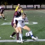 RYAN SPARKS | THE DAILY WORLD Montesanos Mikayla Stanfield is shielded by Lakeside-Nine Mile Falls midfielder Abigail McLellan (8) during Montes 3-1 victory in a state-playoff game on Wednesday at Jack Rottle Field.
