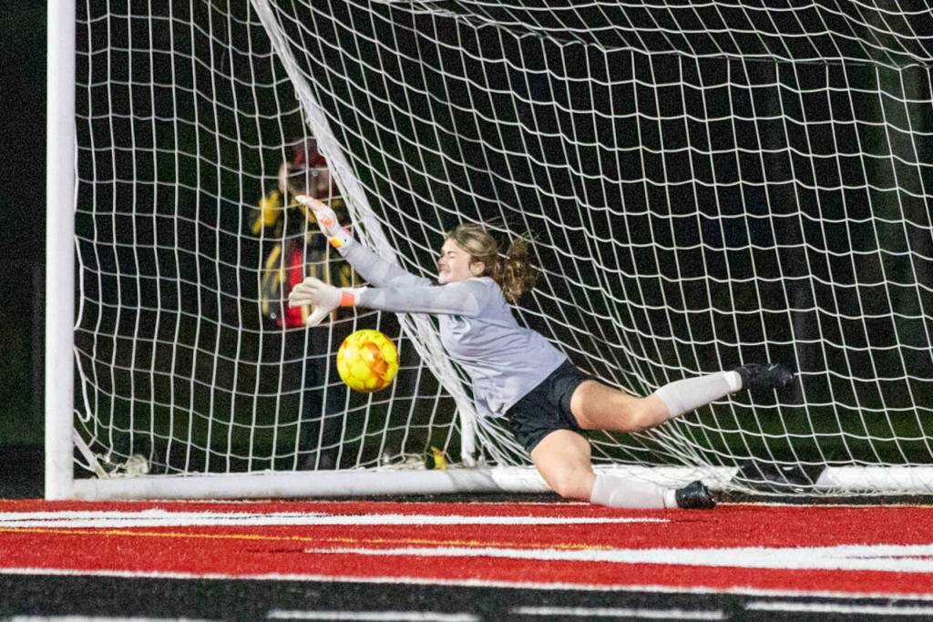 PHOTO BY SHAWN DONNELLY Montesano goal keeper Riley Timmons dives to make a save on a shot by Teninos Ashley Schow in the penalty kick shootout of a 1A State Girls Soccer Tournament quarterfinal match on Saturday in Tenino.