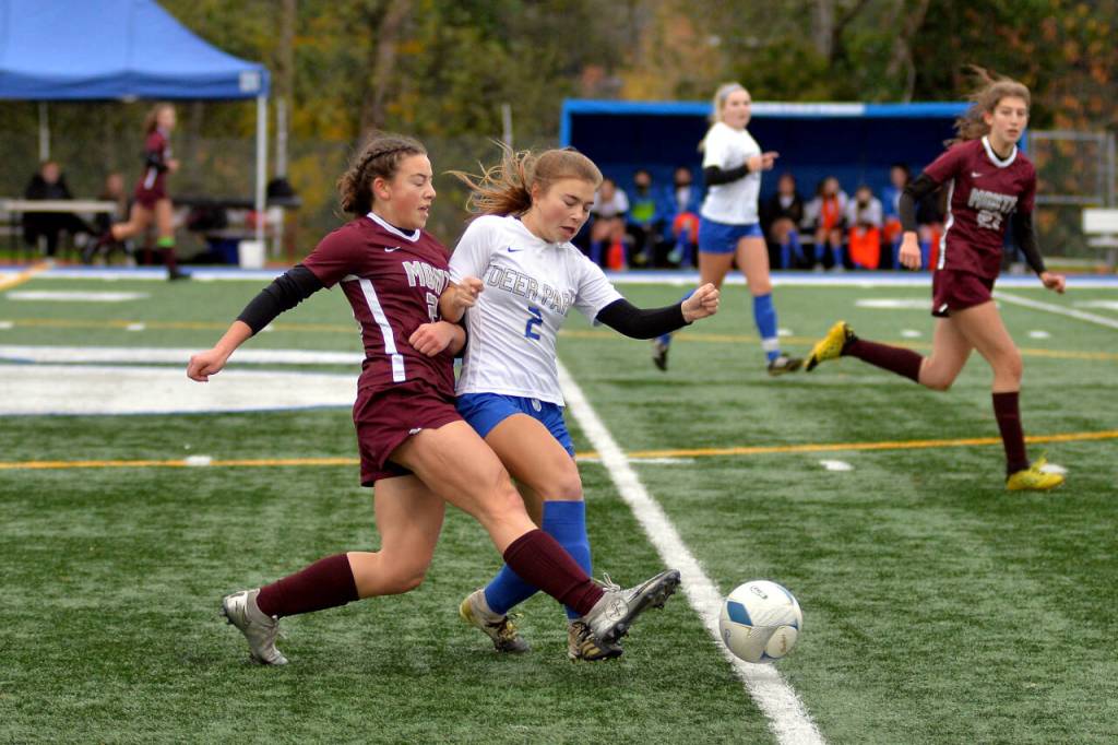 RYAN SPARKS | THE DAILY WORLD Montesanos Jaiden King, left, is defended by Deer Parks Andrea Snell during the Bulldogs 5-1 loss in the 1A State Girls Soccer Tournament semifinals on Friday at Shoreline Stadium in Shoreline.
