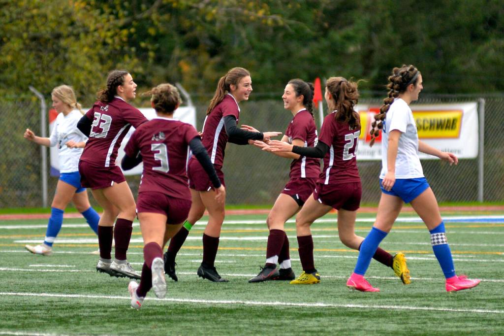 RYAN SPARKS | THE DAILY WORLD Montesano midfielder/forward Jaiden Morrison, third from left, is congratulated by her teammates after scoring a goal just before halftime in a 5-1 loss to Deer Park in a 1A State Girls Soccer Tournament semifinal game on Friday in Shoreline.