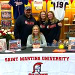 SUBMITTED PHOTO Pe Ell-Willapa Valley standout pitcher Olivia Matlock, seated, signed a National Letter of Intent on Thursday to play softball for Saint Martins University. Pictured with Matlock are family members (from left), Pat Matlock (father), Torrie Matlock (mother) and Lauren Matlock (sister).