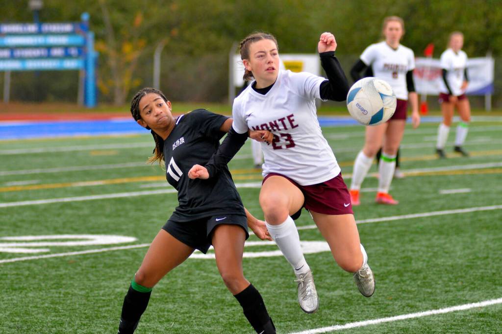 RYAN SPARKS | THE DAILY WORLD Montesano midfielder Jaiden King (23) makes a play against Klahowyas Amira Lyons during Montes 5-0 loss in the states third/fourth-place game on Saturday at Shoreline Stadium in Shoreline.