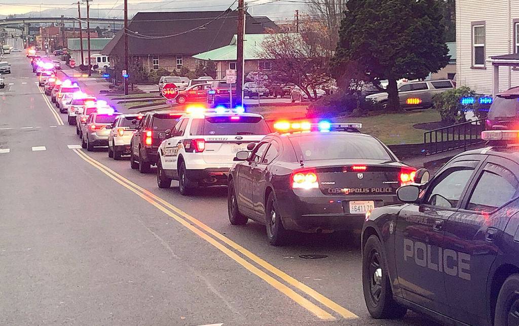 The procession weaves through Aberdeen before arriving at Walmart.
