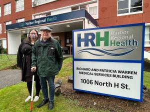 Brother of late-Patricia Warren, Raymond Lee, stands with a cane next to his adopted daughter Jarlene Lee. The two family members were in attendance for the ribbon-cutting on Wednesday, Dec. 1, to celebrate the renamed Richard and Patricia Warren Medical Services Building, which sits at 1006 North H. St. (Matthew N. Wells | The Daily World)
