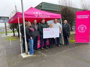 Photo by Matthew N. Wells 
T-Mobile gifted a $50,000 check to the nonprofit group the Friends of Highland Park, which has worked with the city to get the grant. The grant will help the citys desire to get an all-inclusive playground.