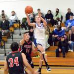 RYAN SPARKS | THE DAILY WORLD
Elma's Cason Seaberg (10) drives to the basket against Columbia-White Salmon's Dylan Connely (14) during the Eagles 69-46 victory on Friday in Elma.