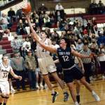 RYAN SPARKS | THE DAILY WORLD
Montesano's Christian Olsen shoots while being defended by King's Way Christian's Isaac Pisarczyk during the Bulldogs 62-30 loss on Friday in Montesano.