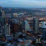 Don Bartletti | Los Angeles Times, file photo 
Twilight settles over Seattle and its waterfront in a view from the Space Needle on Jan. 16, 2015. Ferry boats from Pier 50 cross Puget Sound to Bainbridge Island. The Seattle Ferris Wheel is on Pier 57.