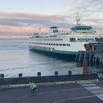 A cyclist rides from a ferry into downtown Seattle during a lonely commute March 9, as more people were working from home due to the coronavirus. Tribune News Service