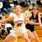 RYAN SPARKS | THE DAILY WORLD Hoquiams Kamryn Krohn (34) and Aberdeens Abby Martinez prepare for a rebound during the Bobcats 52-46 victory on Friday at in Hoquiam.