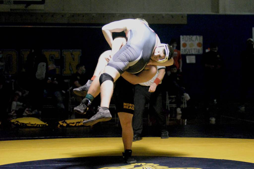 RYAN SPARKS | THE DAILY WORLD North Beachs Johnny Jerome picks up Sheltons Ty Lacy during the final match of the 220 pound weight class at the Grays Harbor Championships boys wrestling meet Saturday at Aberdeen High School.