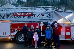 Erika Gebhardt | The Daily World 
Two fire engines from the HFD participated in the deliveries and were lit up for pictures.