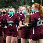 DAILY WORLD FILE PHOTO The Montesano girls soccer team hoist up its 1A District Championship trophy after winning the title against Tenino in March.