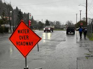 The area just before the intersection and at the intersection of B Street and Market St., was covered with water to the point where cars were making wakes during their morning drives into work on Thursday, Jan. 6, 2022. Matthew N. Wells | The Daily World