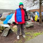 The former professional guitarist, Andrew "Drew" Carey, tells a little about his life on Friday morning, Jan. 7, plus his life after the flooding between Tuesday, Jan. 4 and Thursday Jan. 6, at the now closed homeless encampment at the corner of East 1st Street and North I Street, in Aberdeen. Several homeless residents still live there and Carey said they need to carry their belongings with them wherever they go. (Matthew N. Wells | The Daily World)