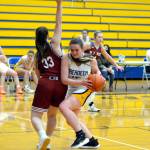 RYAN SPARKS | THE DAILY WORLD Aberdeen center Zoe Filan, right, maneuvers around WF West forward Maggie Bussee during Aberdeens 66-28 loss to WF West on Tuesday in Aberdeen.