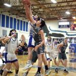 RYAN SPARKS | THE DAILY WORLD Montesano guard Jaxson Wilson (10) competes with Elmas Jerred Bailey for a rebound during Montesanos 57-51 victory on Tuesday at Elma High School.