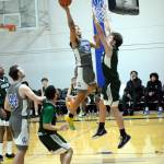 RYAN SPARKS | THE DAILY WORLD Grays Harbor College power forward David Featherston (32) scores against Highlines Luke Brower in the first half of the Chokers 64-63 victory on Wednesday in Aberdeen.