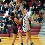 RYAN SPARKS | THE DAILY WORLD Montesano senior Paige Lisherness (23) blocks a shot from Teninos Alivia Hunter during the third quarter of the Bulldogs 51-43 victory on Friday in Montesano.
