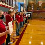 ERICA GEBHARDT | THE DAILY WORLD Honorees participate in a Title IX 50th Anniversary celebration during the Rochester-Hoquiam girls basketball game Friday at Hoquiam High School.