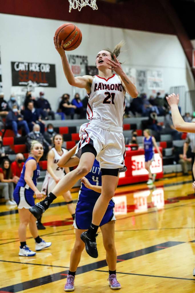 PHOTO BY LARRY BALE Raymonds Kyra Gardner glides to the hoop for two of her game high 30 points in the Seagulls 78-24 victory over Toutle Lake in the opening round of the 2B District 4 Tournament on Saturday at Raymond High School.