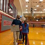 Yvone Jump '59 leads the Title IX honoree progression before taking a spot at center court to greet athletes. Erika Gebhardt I The Daily World