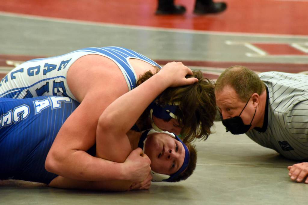 PHOTO BY SUE MICHALAK BUDSBERG Elmas Austin Salazar, top, pins La Centers Lane Roberts to win the 220 pound championship at the WIAA 1A Region 1 Championships on Saturday at Hoquiam High School.