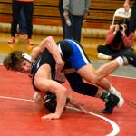 PHOTO BY SUE MICHALAK BUDSBERG Montesanos Cole Ekerson, left. controls Eatonvilles Ty Whitney during the 132 pound title match at the WIAA 1A Region 1 Championships on Saturday at Hoquiam High School.