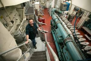 Ryan Berry | The daily Herald
Bart Lematta stands in the engine room of his ferry on Feb. 8, 2022, along the shore of Langley.