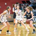 RYAN SPARKS | THE DAILY WORLD Montesanos Mikayla Stanfield (10) and Maia Young (13) defend against Kings Way Christian guard Bridget Quinn during the Bulldogs 53-39 victory in the 1A District 4 semifinals on Tuesday in Montesano.
