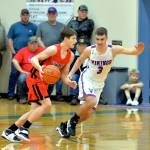 RYAN SPARKS | THE DAILY WORLD Willapa Valley guard Tyler Adkins (3) defends Mossyrocks Easton Kolb during Willapa Valleys 56-39 victory in a 1B District 4 semifinal matchup on Thursday in Menlo.