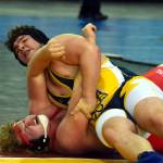 PHOTO BY SUE MICHALAK BUDSBERG Aberdeens Erick Hayter-Ramsey, top, wrestles at the Mat Classic XXXII state-championship tournament on Friday at the Tacoma Dome.
