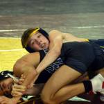 PHOTO BY SUE MICHALAK BUDSBERG Aberdeens Mikey Hatton, top, wrestles at the Mat Classic XXXII state-championship tournament on Friday at the Tacoma Dome.