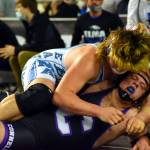 PHOTO BY SUE MICHALAK BUDSBERG Elmas Austin Salazar, top, wrestles at the Mat Classic XXXII state-championship tournament on Friday at the Tacoma Dome.
