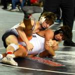 PHOTO BY SUE MICHALAK BUDSBERG Montesanos Cole Ekerson, left, competes at the Mat Classic XXXII state-championship tournament on Friday at the Tacoma Dome.